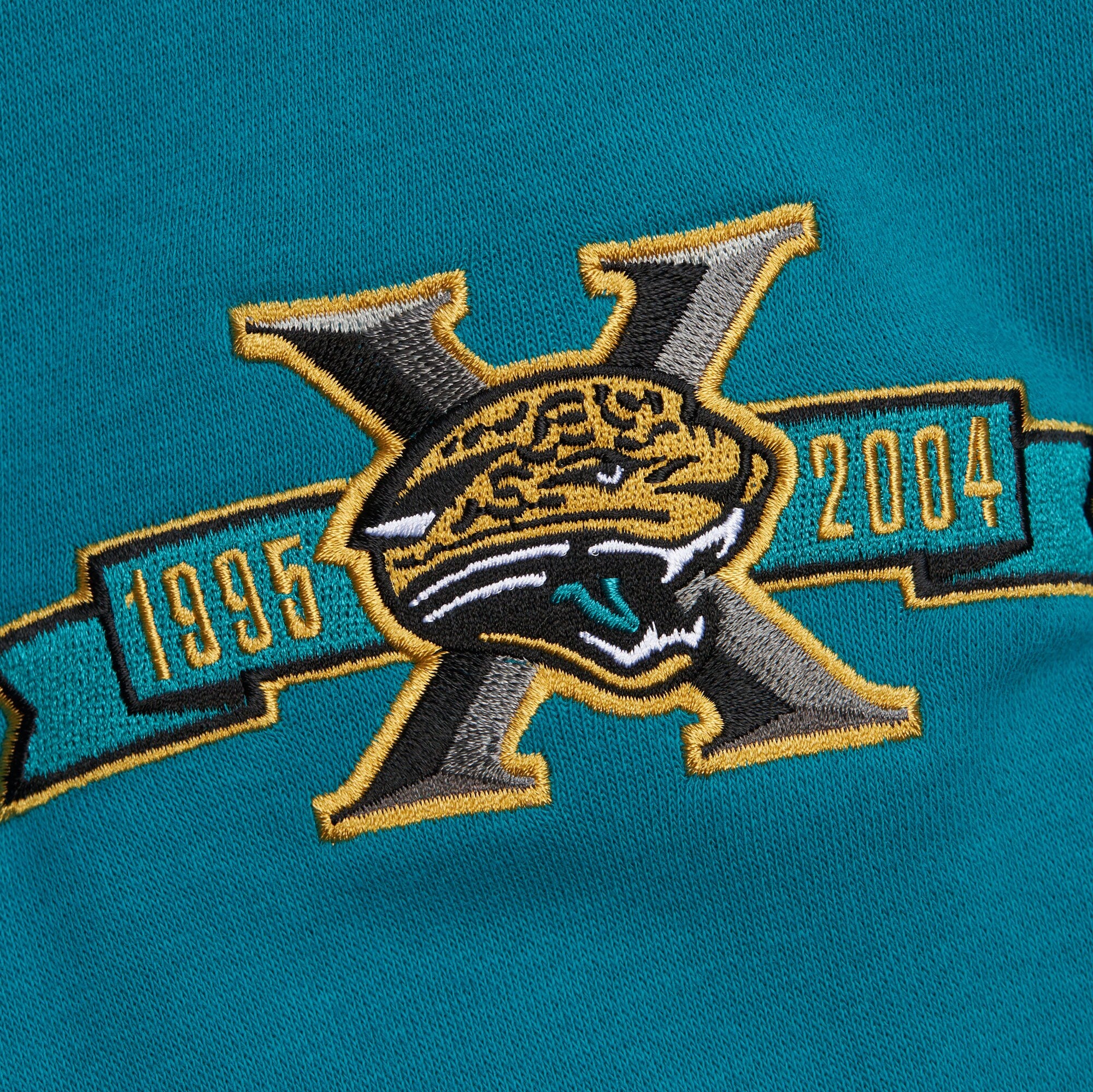 Jacksonville Jaguars Mitchell & Ness All Over Crew 4.0 Vintage Logo